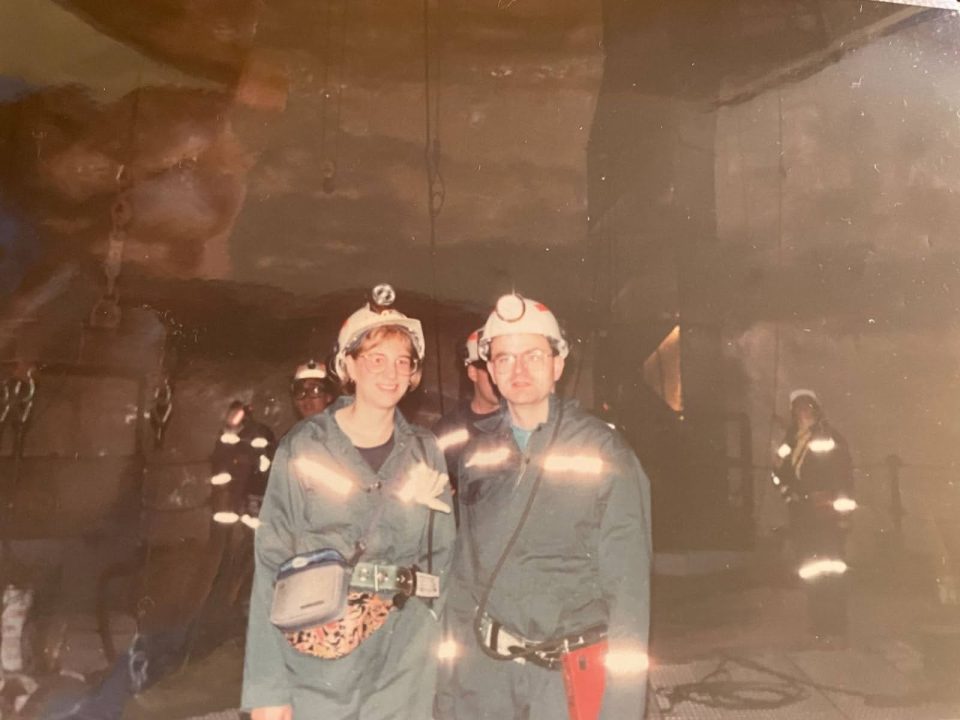 A photo from 1994 with Meg Freer and Dan Deptuck dressed in mining gear in the underground cavern of the SNO experiment.